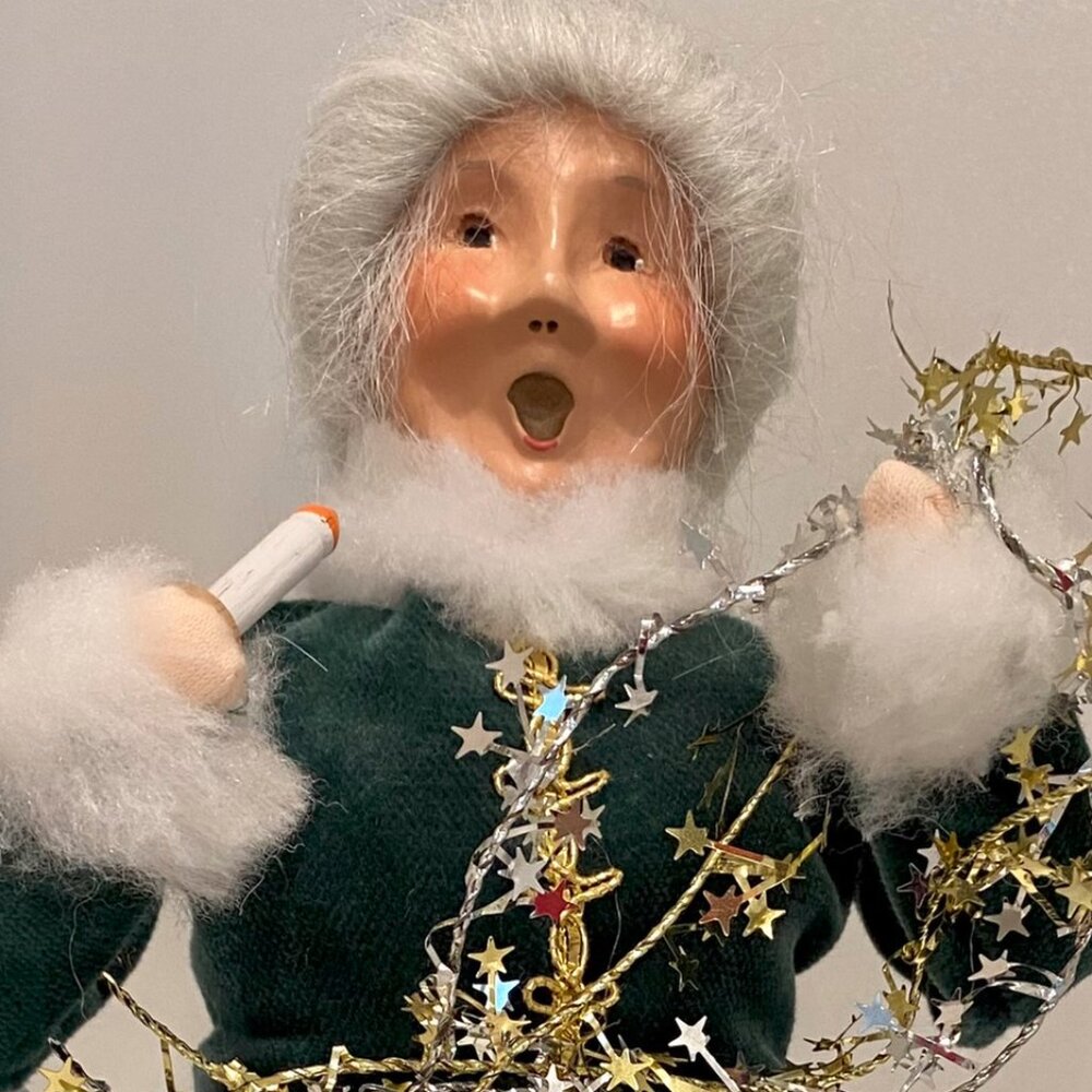 Byers' Choice Old Woman decorating the tree